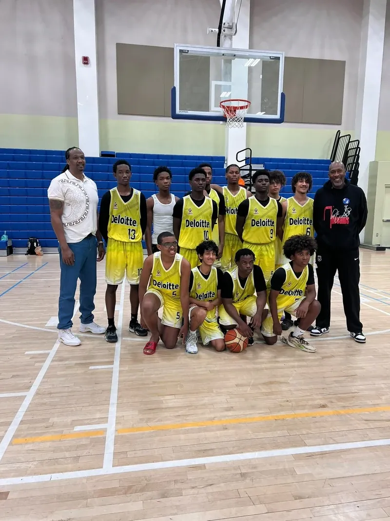 Youth basketball team photo in the gym | Cory McGee